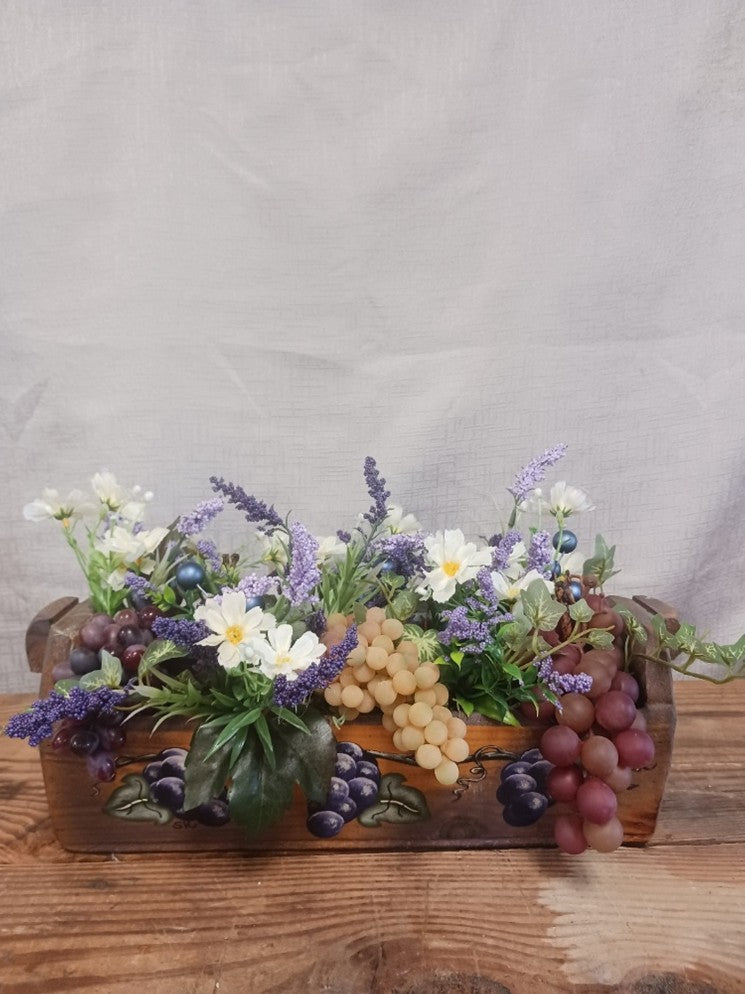 Wooden Widmer's grape box with grapes, flowers, and ivy